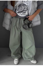 Спортивні штани жіночі фісташкового кольору 172783L