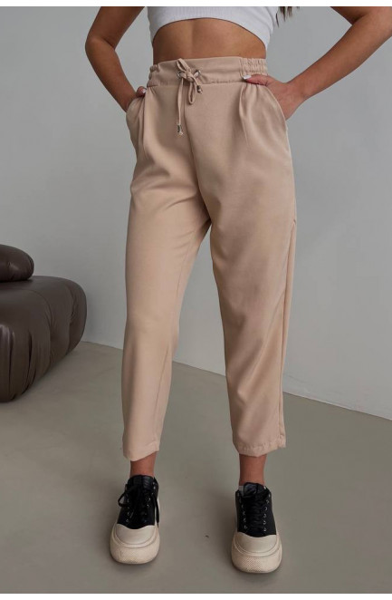 Штани жіночі бежевого кольору 179130L